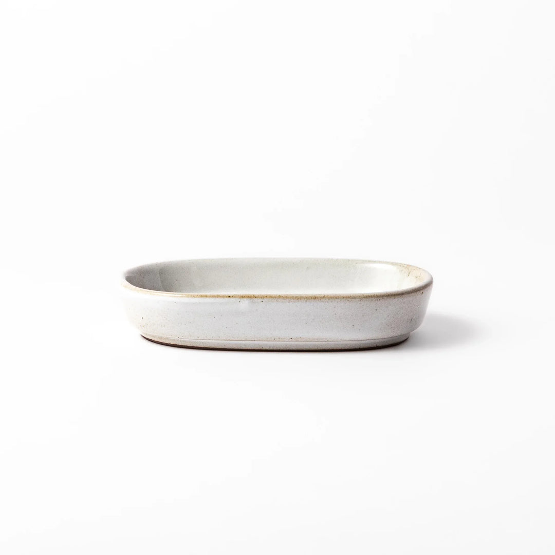 White ceramic ginger grater dish with a natural glaze and raised teeth, ideal for finely grating ginger, garlic, or wasabi with minimal effort.