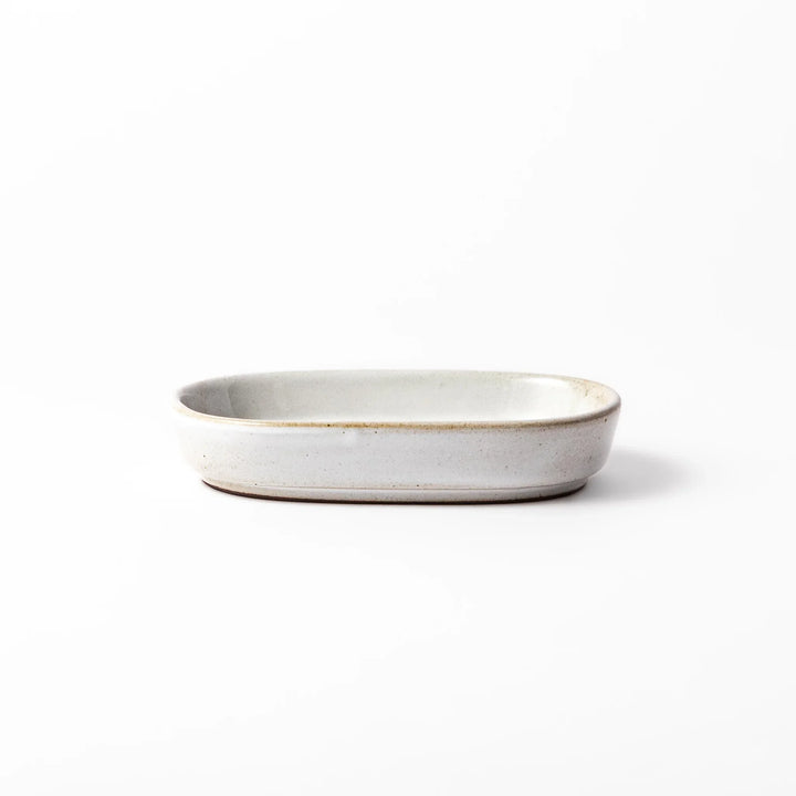 White ceramic ginger grater dish with a natural glaze and raised teeth, ideal for finely grating ginger, garlic, or wasabi with minimal effort.