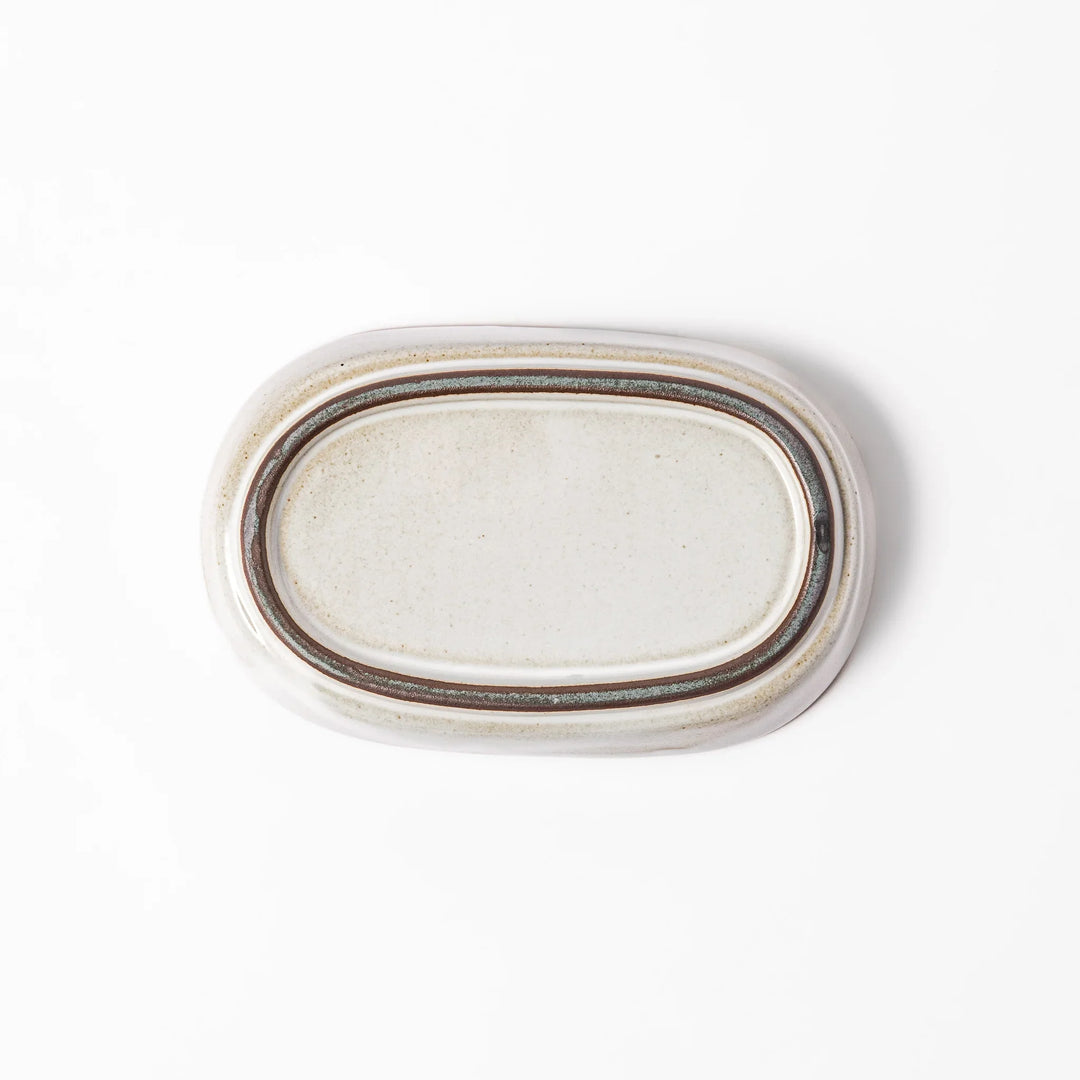 White ceramic ginger grater dish with a natural glaze and raised teeth, ideal for finely grating ginger, garlic, or wasabi with minimal effort.