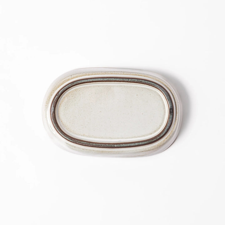 White ceramic ginger grater dish with a natural glaze and raised teeth, ideal for finely grating ginger, garlic, or wasabi with minimal effort.