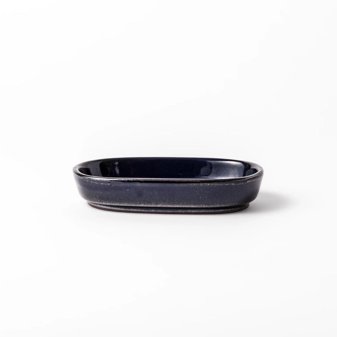 Deep blue ceramic ginger grater dish with raised teeth and a shallow base, designed for efficiently grating ginger, garlic, or daikon.