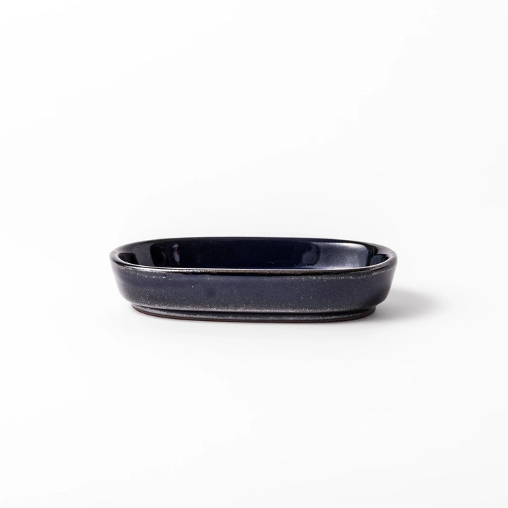 Deep blue ceramic ginger grater dish with raised teeth and a shallow base, designed for efficiently grating ginger, garlic, or daikon.