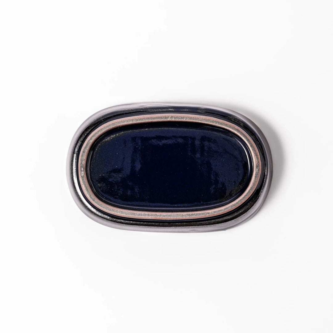 Deep blue ceramic ginger grater dish with raised teeth and a shallow base, designed for efficiently grating ginger, garlic, or daikon.
