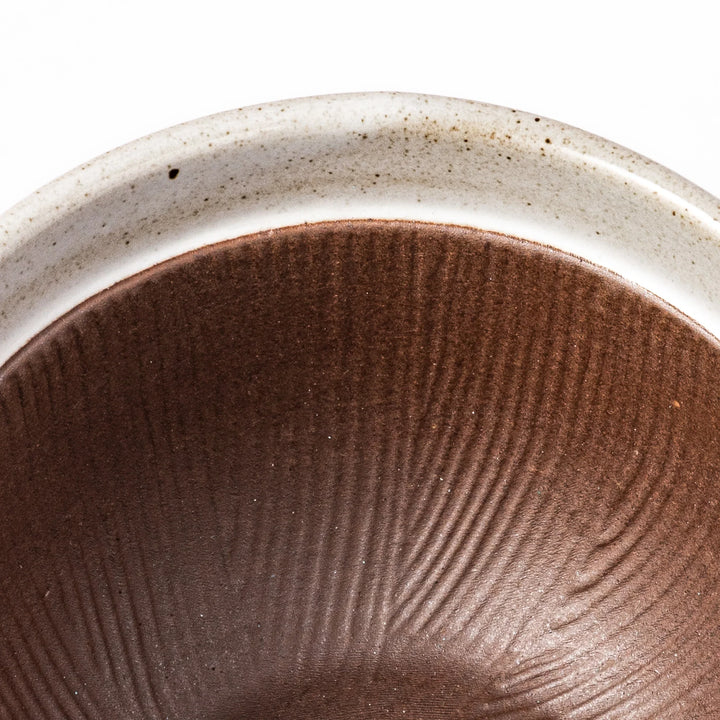 White ceramic natto suribachi bowl with a textured brown interior and side handle, ideal for grinding ingredients or mixing natto with control.