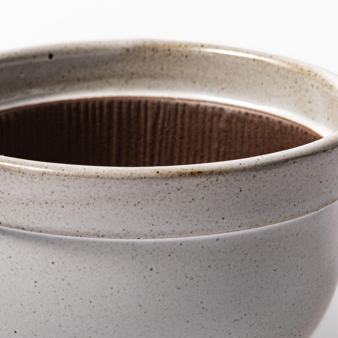 White ceramic natto suribachi bowl with a textured brown interior and side handle, ideal for grinding ingredients or mixing natto with control.