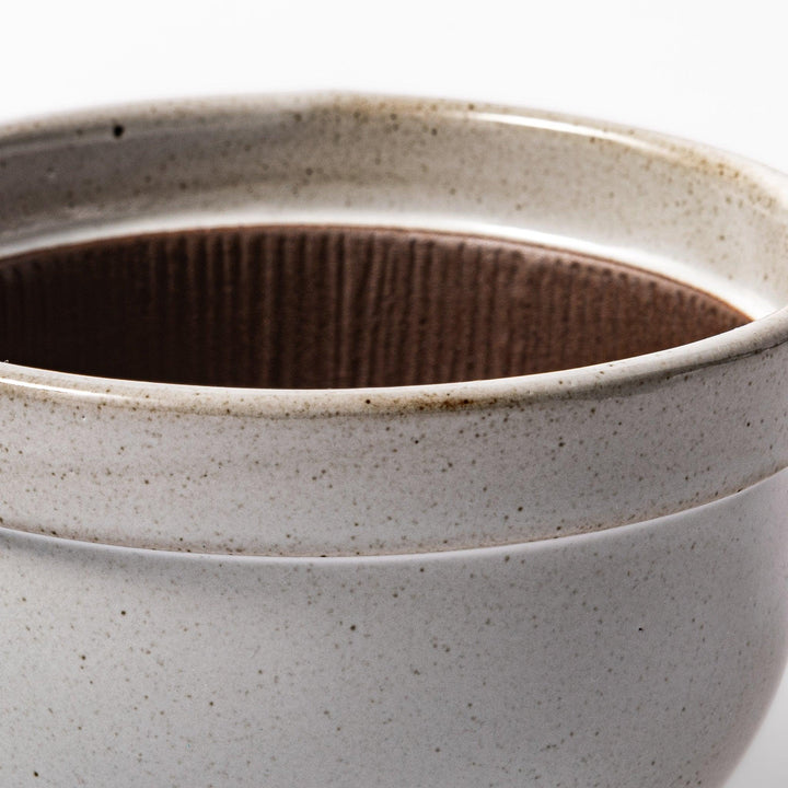 White ceramic natto suribachi bowl with a textured brown interior and side handle, ideal for grinding ingredients or mixing natto with control.