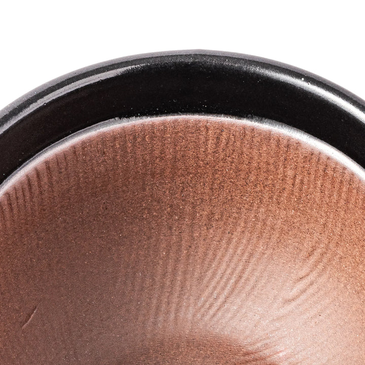 Black ceramic natto suribachi bowl with a ridged brown interior and side handle, ideal for grinding and mixing natto or other small ingredients.