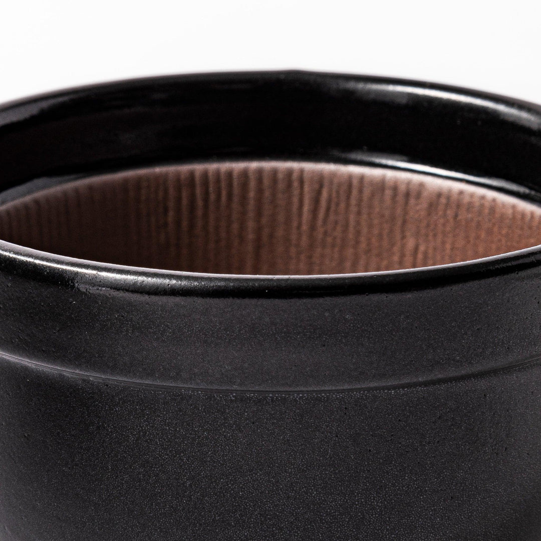 Black ceramic natto suribachi bowl with a ridged brown interior and side handle, ideal for grinding and mixing natto or other small ingredients.