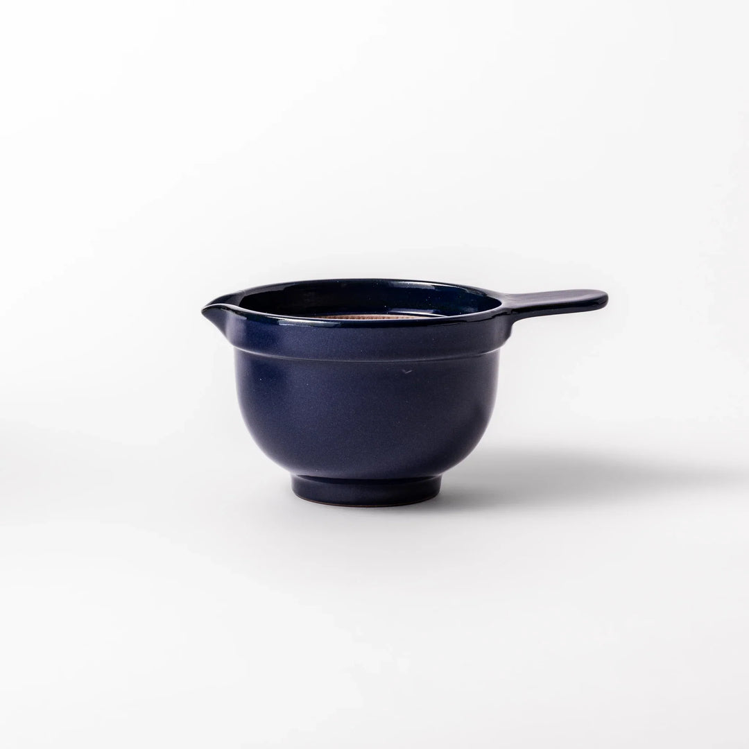 Deep blue ceramic natto suribachi bowl with ridged brown interior and side handle, perfect for mixing natto or grinding small ingredients with ease.