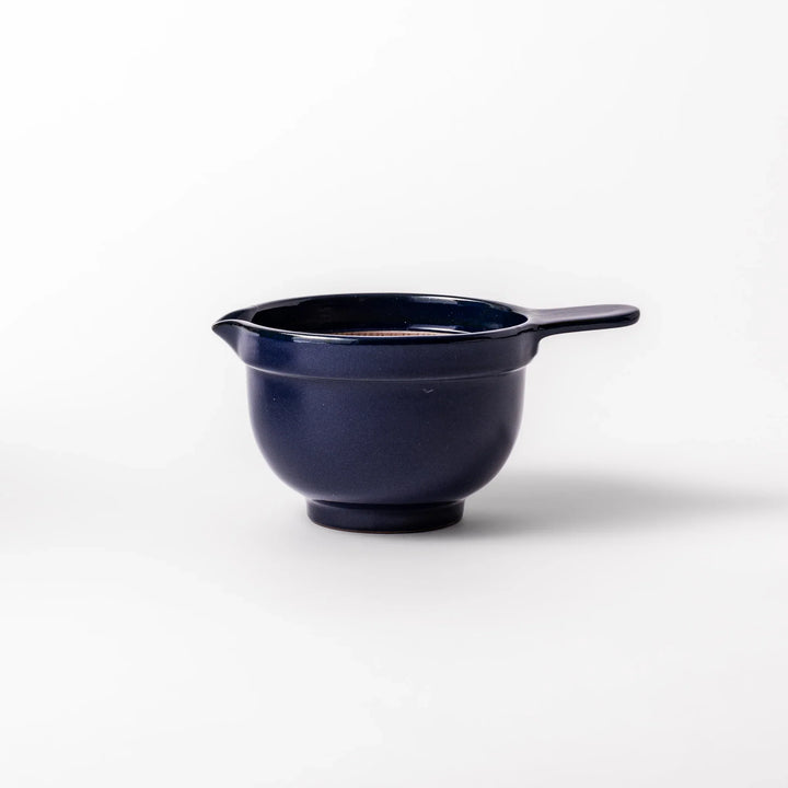 Deep blue ceramic natto suribachi bowl with ridged brown interior and side handle, perfect for mixing natto or grinding small ingredients with ease.
