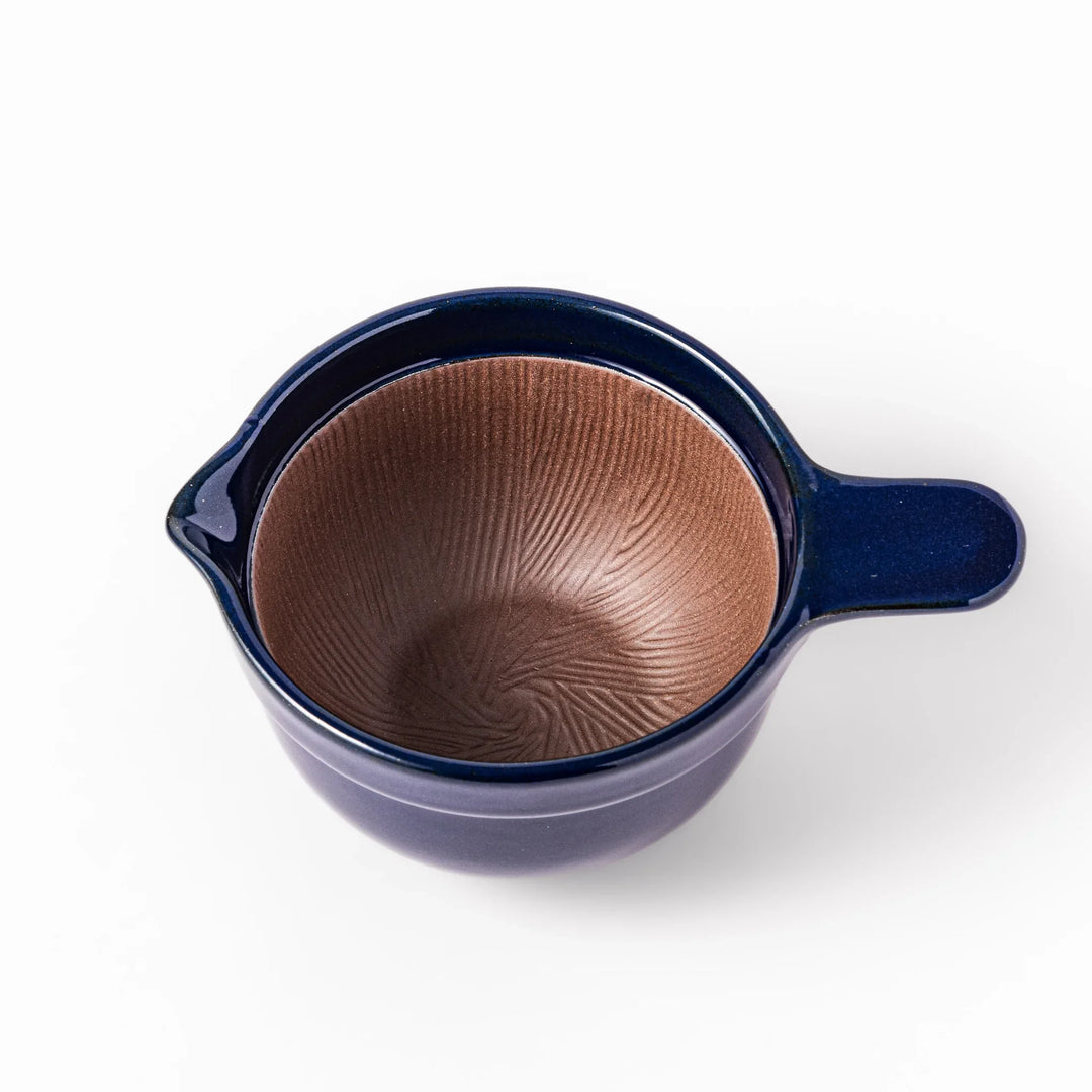 Deep blue ceramic natto suribachi bowl with ridged brown interior and side handle, perfect for mixing natto or grinding small ingredients with ease.
