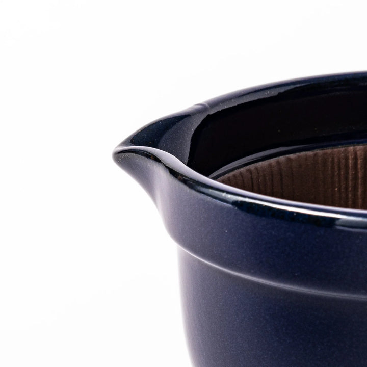 Deep blue ceramic natto suribachi bowl with ridged brown interior and side handle, perfect for mixing natto or grinding small ingredients with ease.