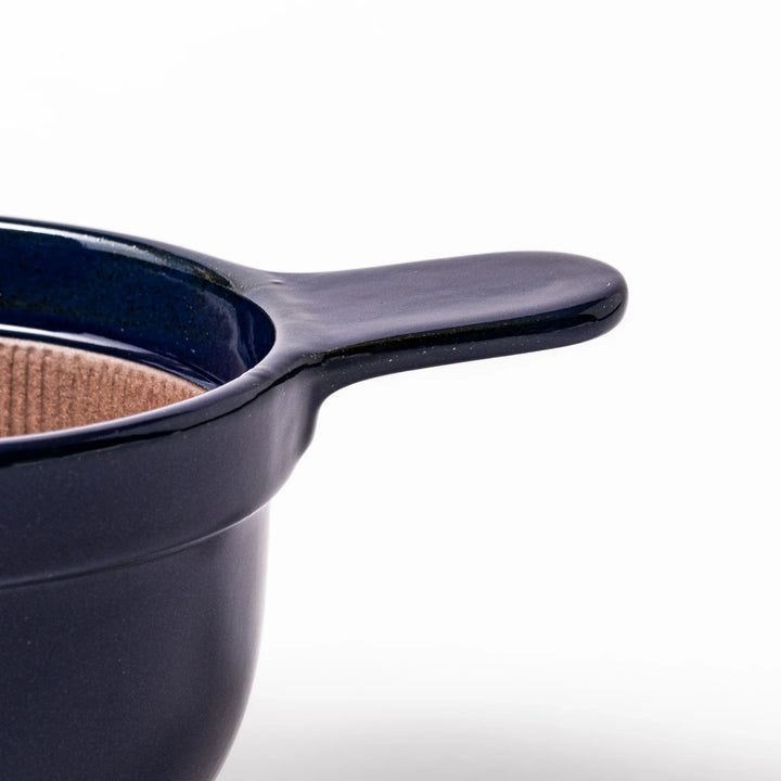 Deep blue ceramic natto suribachi bowl with ridged brown interior and side handle, perfect for mixing natto or grinding small ingredients with ease.