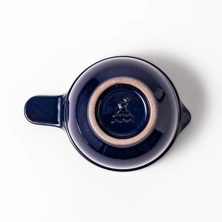 Deep blue ceramic natto suribachi bowl with ridged brown interior and side handle, perfect for mixing natto or grinding small ingredients with ease.