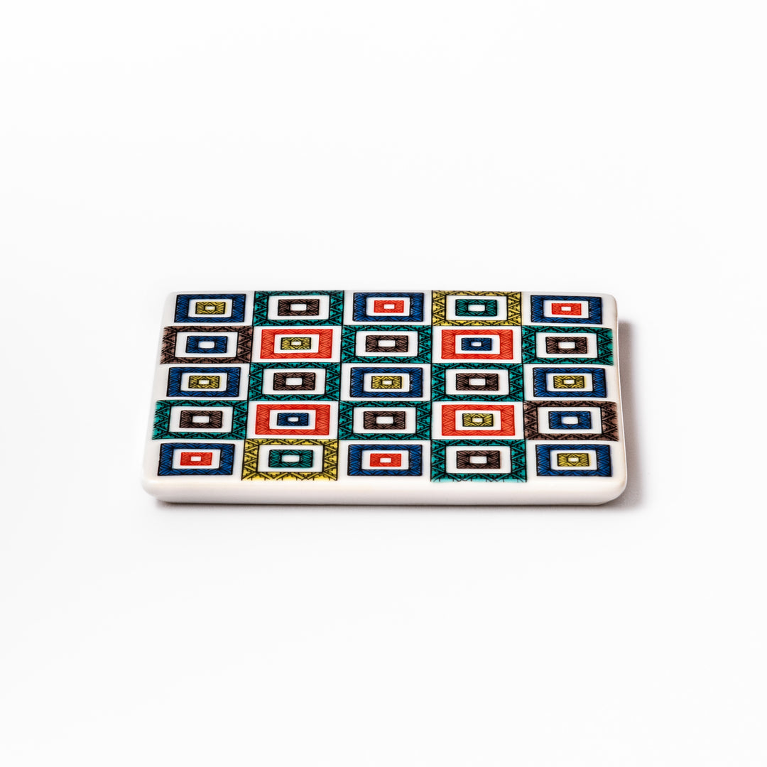 Square Japanese ceramic coaster with colorful cobblestone mosaic pattern in red, blue, green, yellow, and black, ideal for stylish table settings.