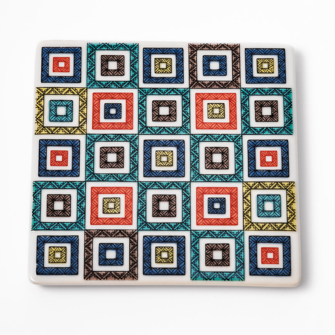 Square Japanese ceramic coaster with colorful cobblestone mosaic pattern in red, blue, green, yellow, and black, ideal for stylish table settings.
