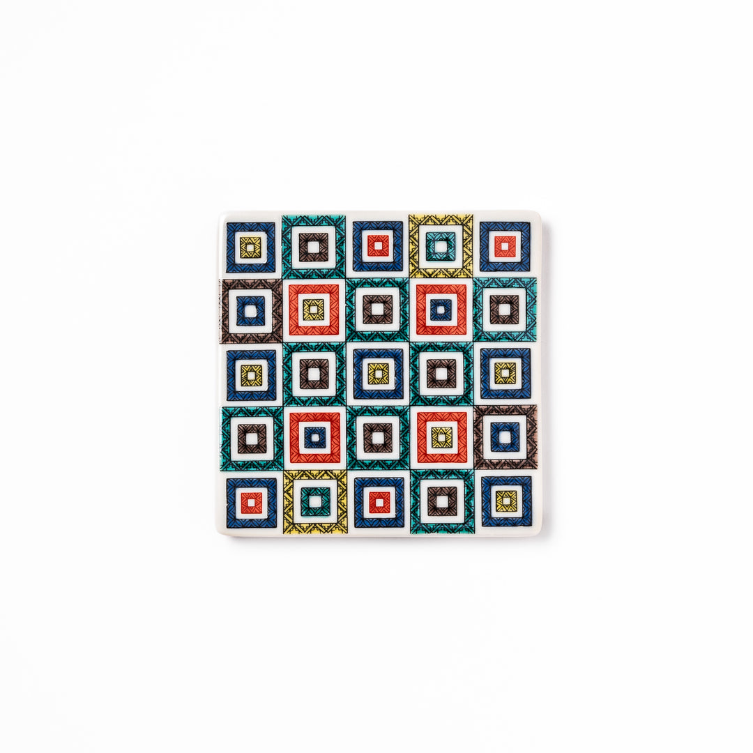 Square Japanese ceramic coaster with colorful cobblestone mosaic pattern in red, blue, green, yellow, and black, ideal for stylish table settings.