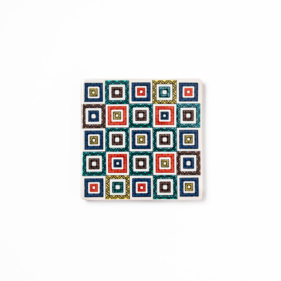 Square Japanese ceramic coaster with colorful cobblestone mosaic pattern in red, blue, green, yellow, and black, ideal for stylish table settings.