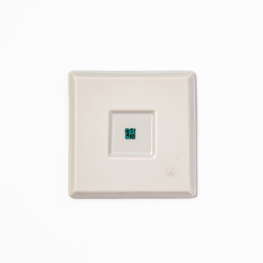 Square Japanese ceramic coaster with colorful cobblestone mosaic pattern in red, blue, green, yellow, and black, ideal for stylish table settings.