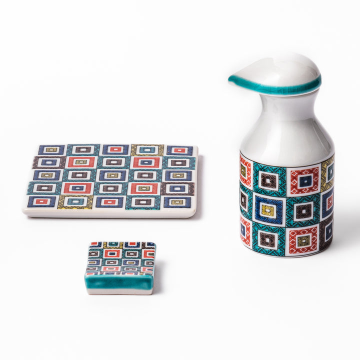 Japanese ceramic set including soy sauce dispenser, coaster, and chopstick rest with colorful cobblestone mosaic pattern, perfect for elegant dining