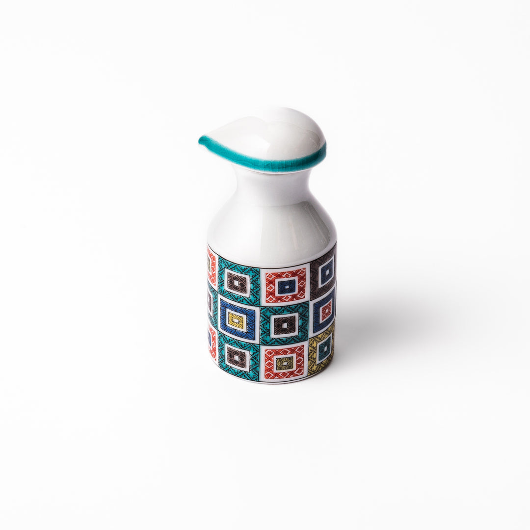 Japanese soy sauce dispenser with colorful cobblestone mosaic pattern in red, green, blue, and yellow, blending tradition with modern design.