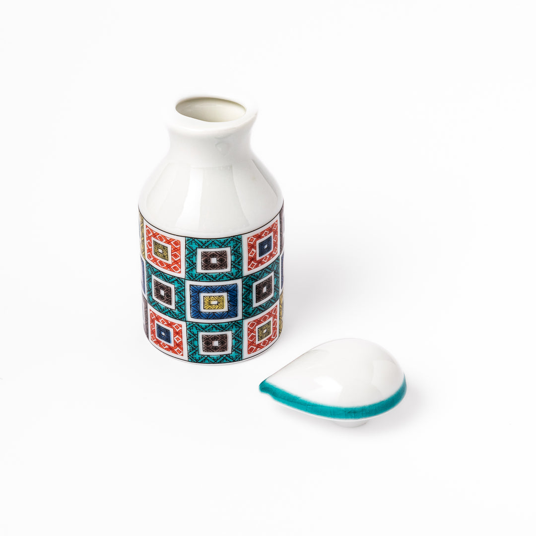 Japanese soy sauce dispenser with colorful cobblestone mosaic pattern in red, green, blue, and yellow, blending tradition with modern design.