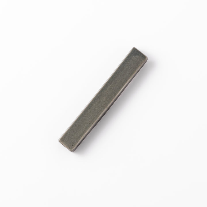 Rectangular ceramic chopstick rest in a soft gray Japandi tone with clean edges and a smooth matte finish