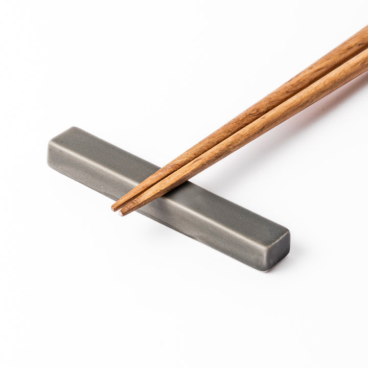 Rectangular ceramic chopstick rest in a soft gray Japandi tone with clean edges and a smooth matte finish