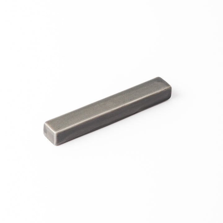 Rectangular ceramic chopstick rest in a soft gray Japandi tone with clean edges and a smooth matte finish