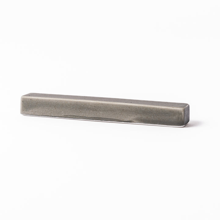 Rectangular ceramic chopstick rest in a soft gray Japandi tone with clean edges and a smooth matte finish