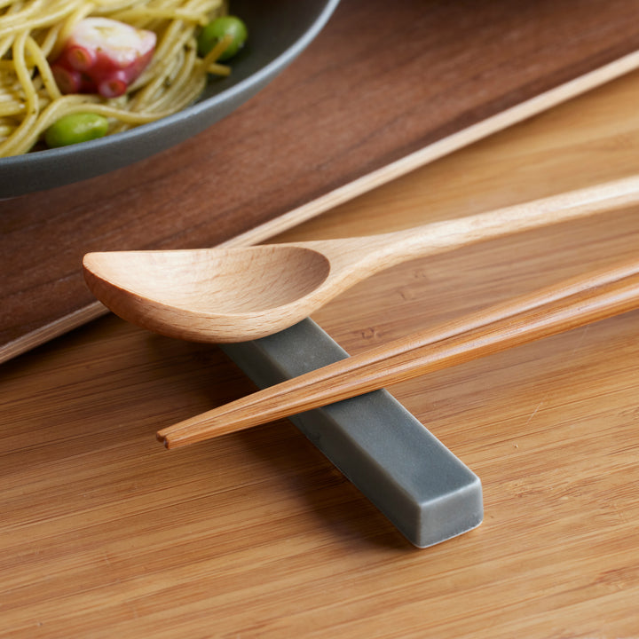 Cozy Japandi Chopstick Rest in matte gray, paired with wooden chopsticks and spoon, adding minimalist elegance to everyday dining.