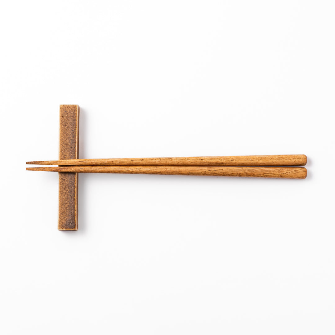 Rectangular ceramic chopstick rest in a warm beige Japandi tone with a minimalist form and smooth glazed finish
