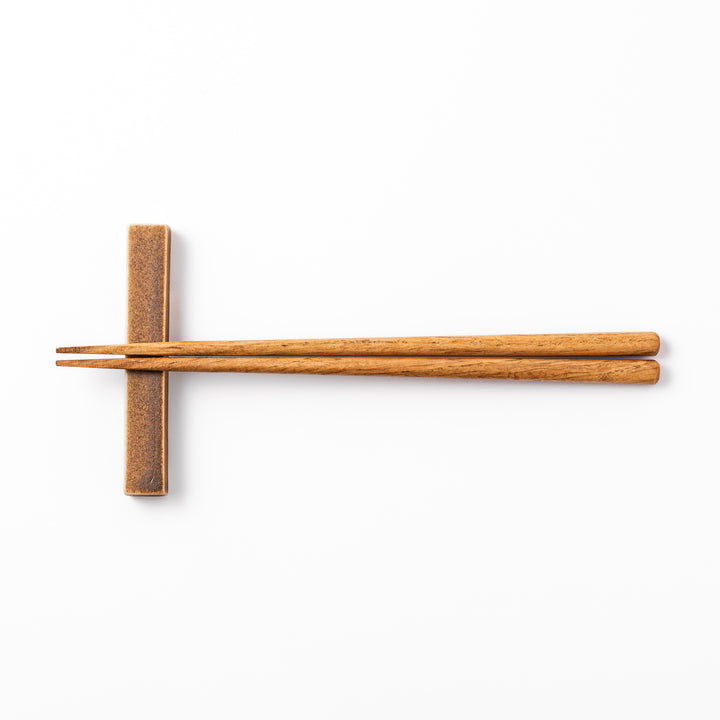 Rectangular ceramic chopstick rest in a warm beige Japandi tone with a minimalist form and smooth glazed finish