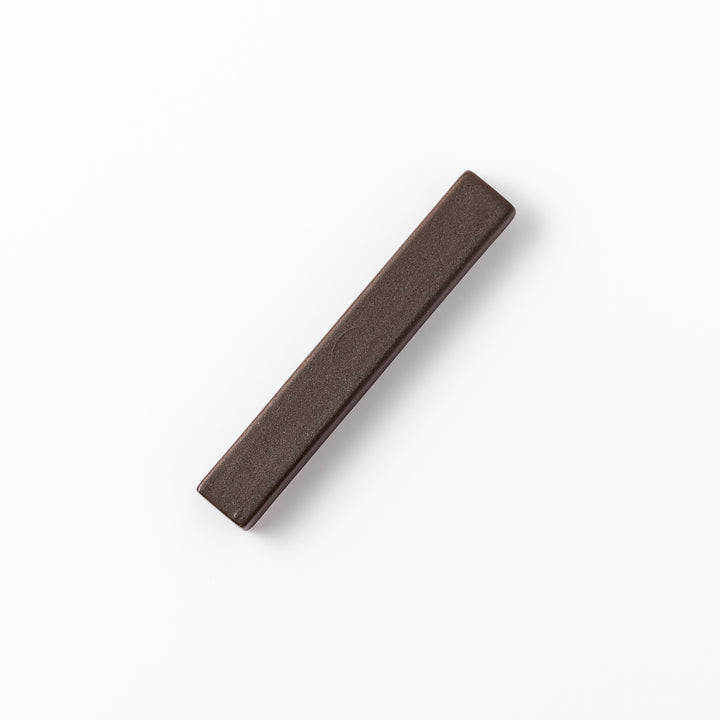 Matte brown rectangular chopstick rest with clean lines and minimalist Japandi style