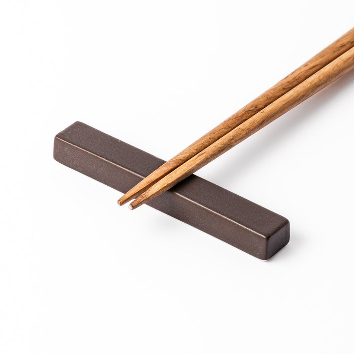 Matte brown rectangular chopstick rest with clean lines and minimalist Japandi style