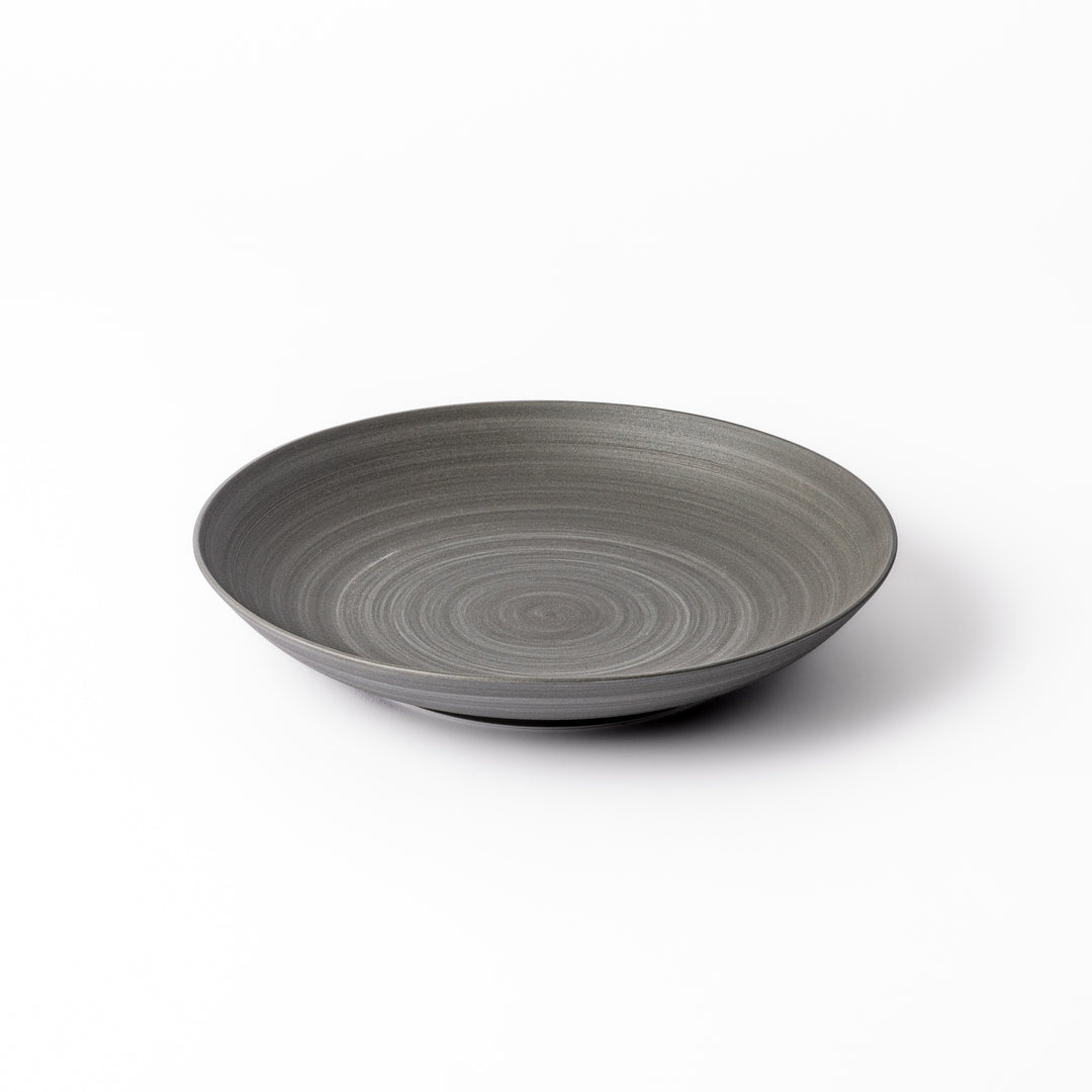 Matte gray salad plate with subtle concentric texture and gently curved sides for a modern Japandi look.