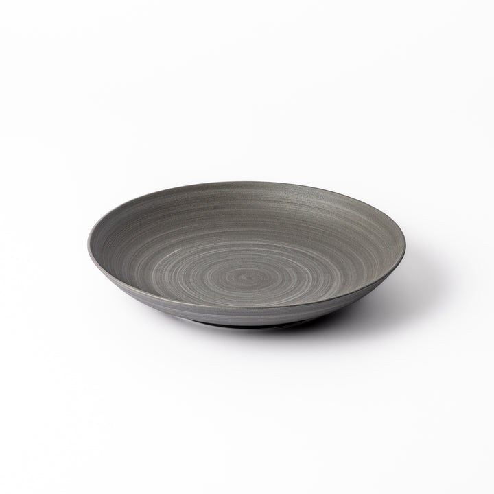 Matte gray salad plate with subtle concentric texture and gently curved sides for a modern Japandi look.