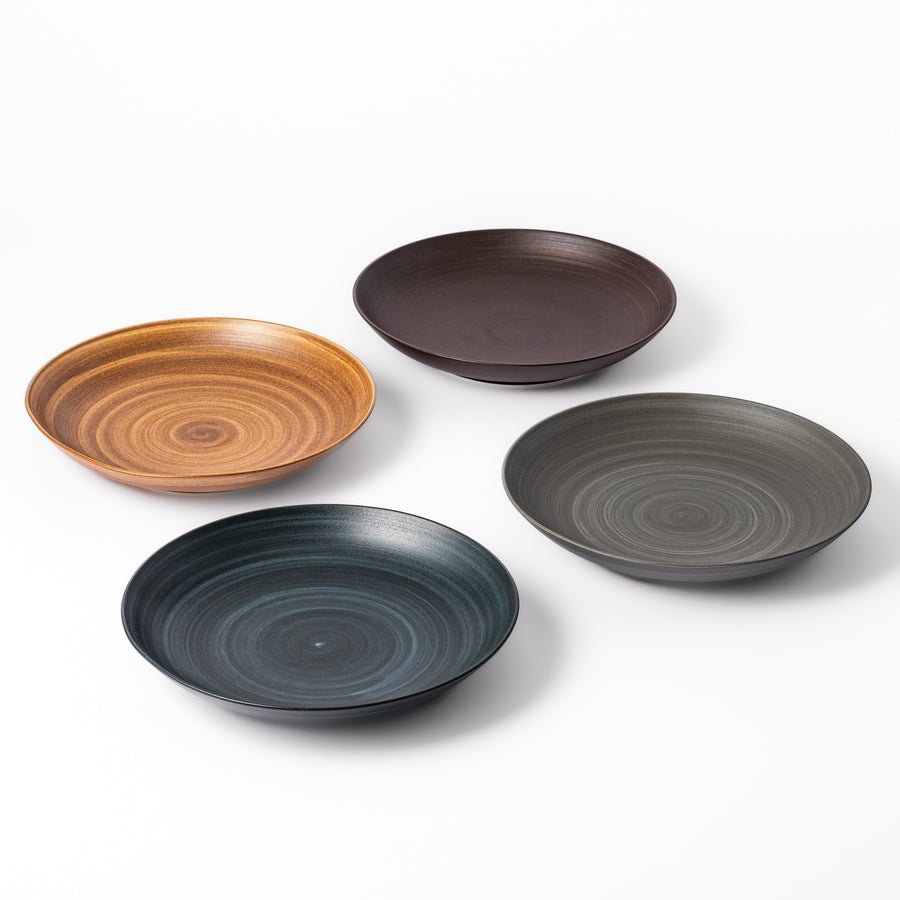 Set of ceramic salad plates in earthy tones with a soft matte finish and concentric swirl pattern. Ideal for Japandi-inspired dining.