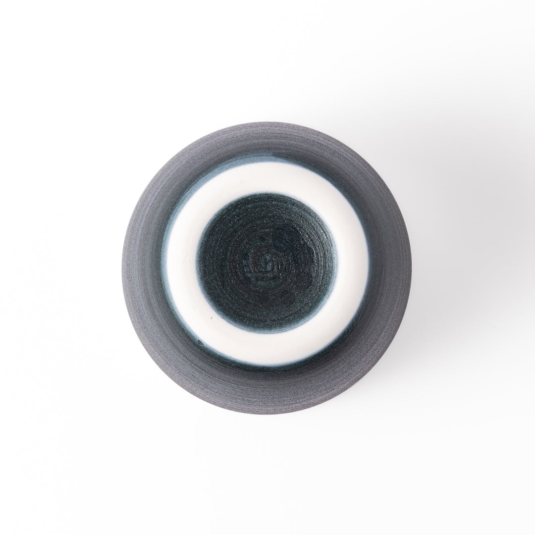 Two-tone ceramic tea cup featuring a soft ivory rim and deep blue base. Perfect for modern, cozy tea moments and Japandi-style settings.