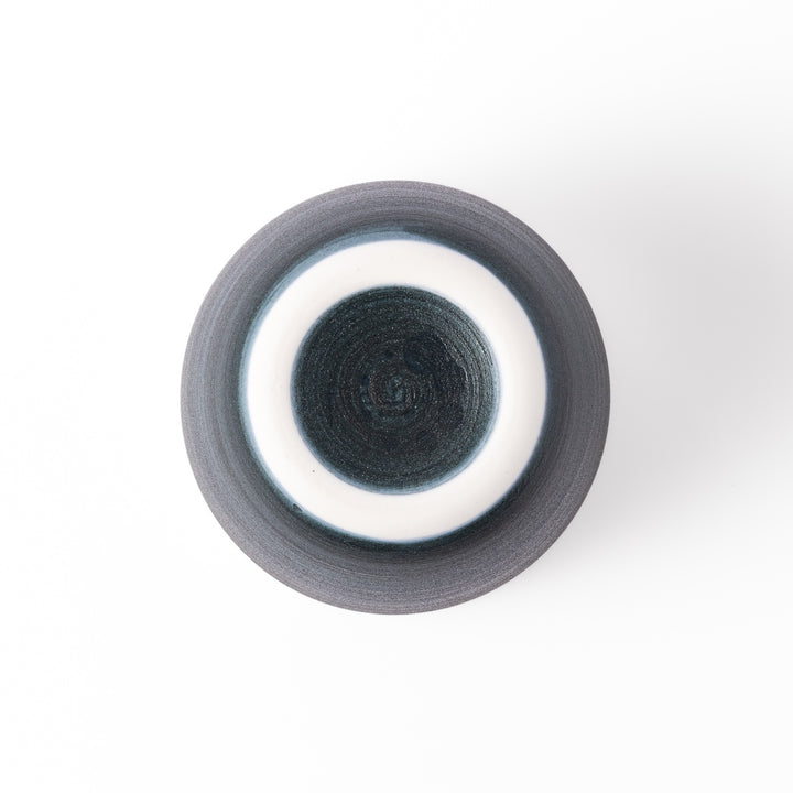 Two-tone ceramic tea cup featuring a soft ivory rim and deep blue base. Perfect for modern, cozy tea moments and Japandi-style settings.