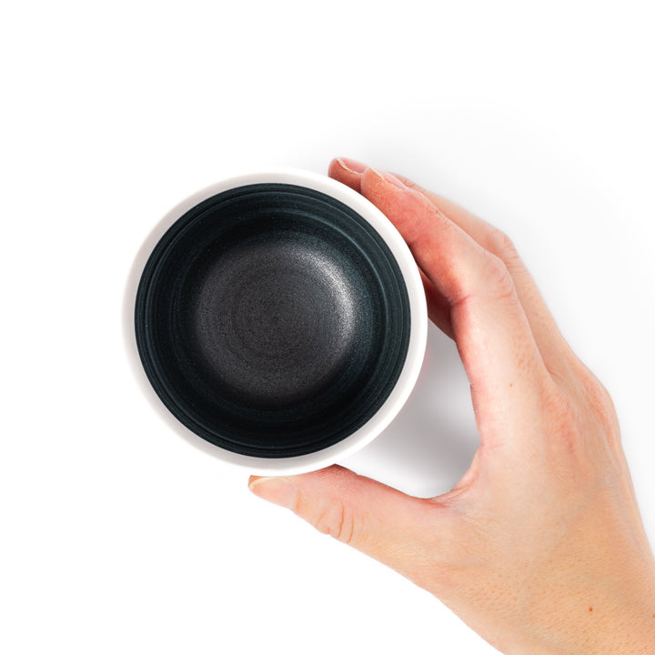 Two-tone ceramic tea cup featuring a soft ivory rim and deep blue base. Perfect for modern, cozy tea moments and Japandi-style settings.