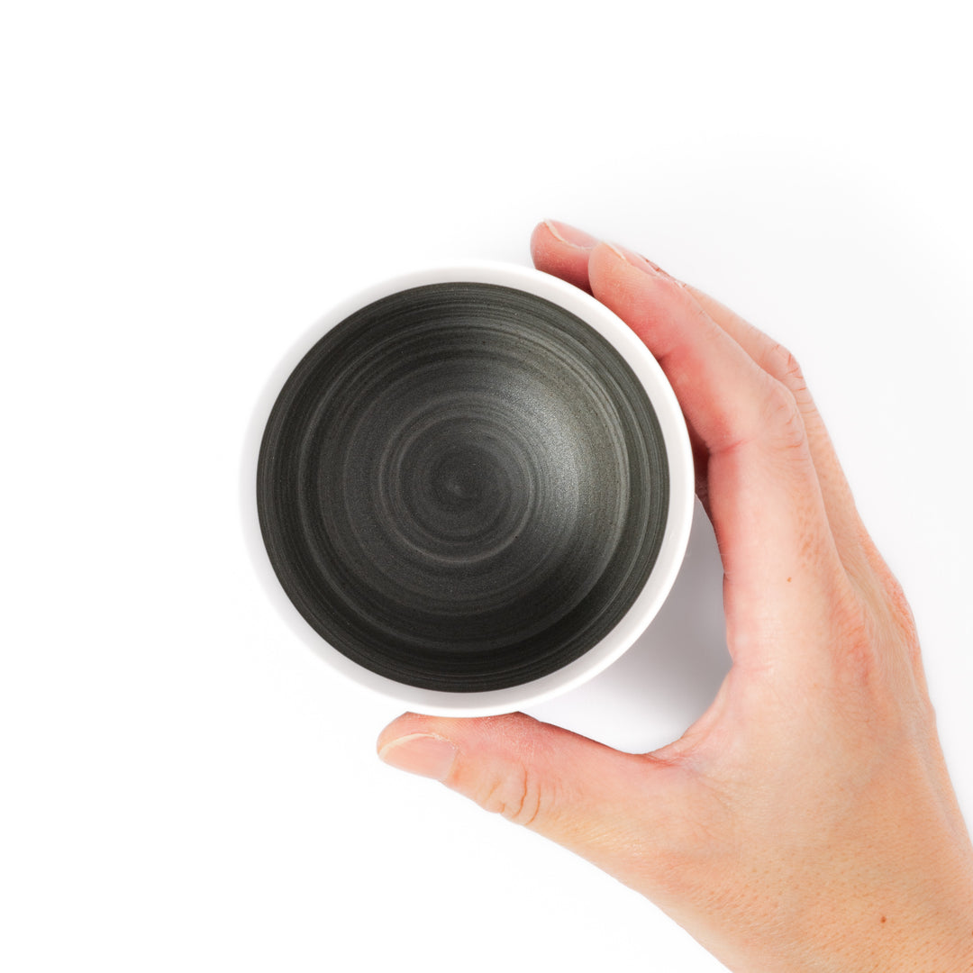 Two-tone ceramic tea cup with a matte ivory rim and earthy gray base. Ideal for serene tea moments and Japandi-inspired tables.
