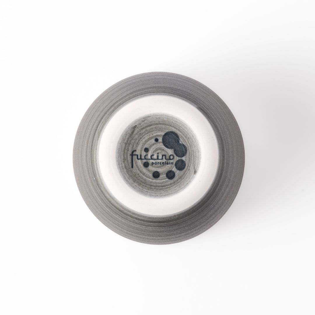 Two-tone ceramic tea cup with a matte ivory rim and earthy gray base. Ideal for serene tea moments and Japandi-inspired tables.