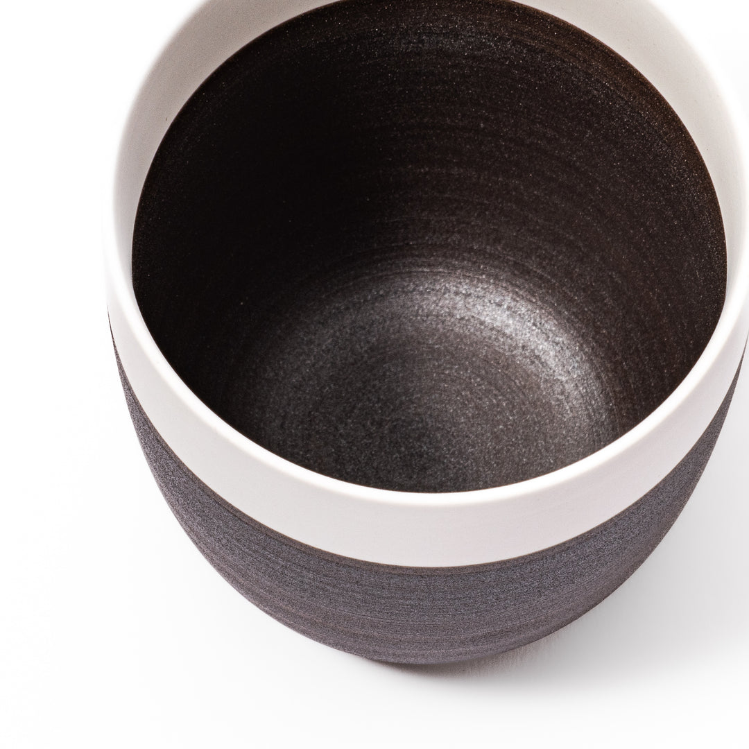 Two-tone ceramic tea cup featuring a smooth matte ivory rim and earthy dark brown base—perfect for warm drinks and everyday comfort.