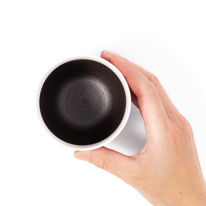 Two-tone ceramic tea cup featuring a smooth matte ivory rim and earthy dark brown base—perfect for warm drinks and everyday comfort.