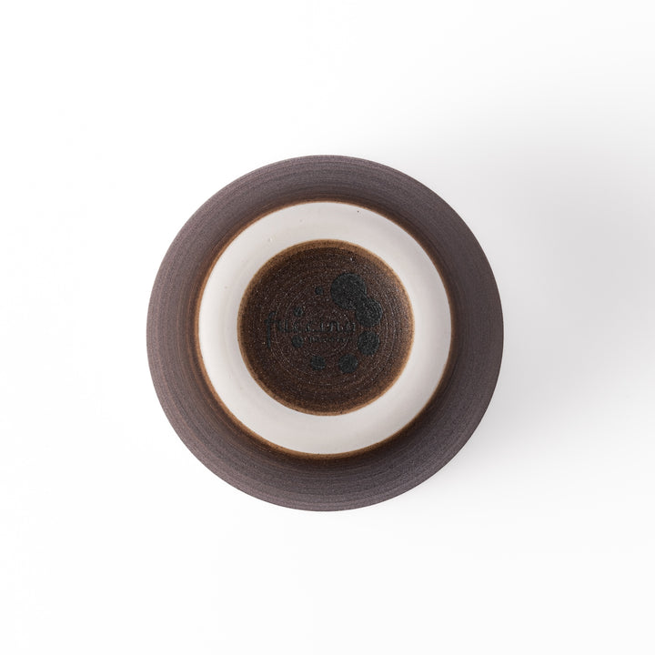 Two-tone ceramic tea cup featuring a smooth matte ivory rim and earthy dark brown base—perfect for warm drinks and everyday comfort.