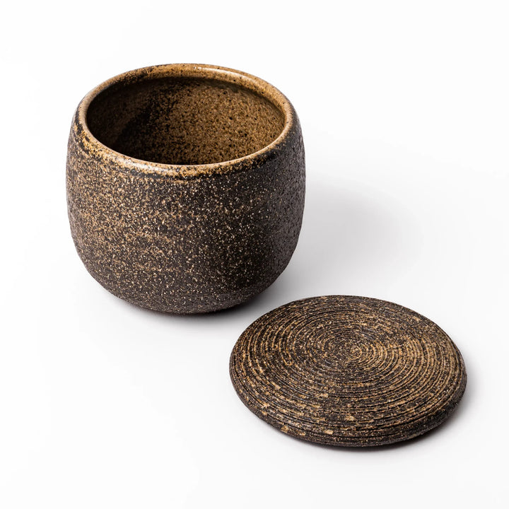Dark brown ceramic rice storage bowl with matching lid, featuring a textured rustic finish, designed for storing freshly cooked rice.
