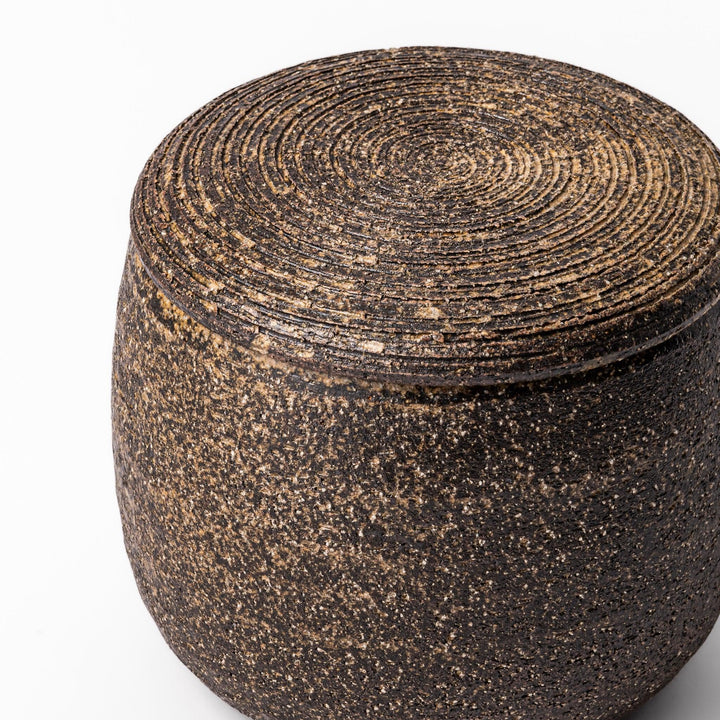 Dark brown ceramic rice storage bowl with matching lid, featuring a textured rustic finish, designed for storing freshly cooked rice.