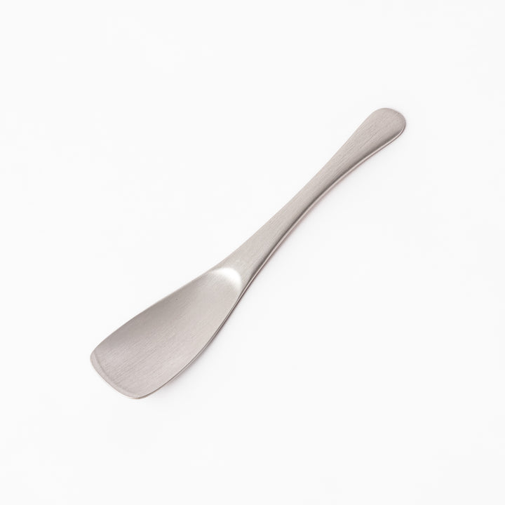 Silver aluminum ice cream spoon with a satin finish and flat edge, engineered for smoothly scooping through even the hardest frozen desserts.