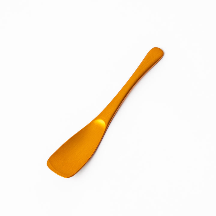 Gold aluminum ice cream spoon with a smooth matte finish and flat scoop edge, designed to glide through hard ice cream with ease and style.